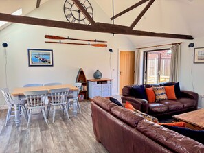 Open plan living and dining for 6 with door leading into fully enclosed garden 