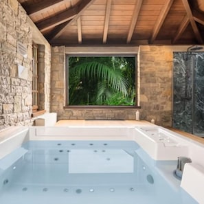 Enclosed Jacuzzi made of imported marble and timber roof for 8 people