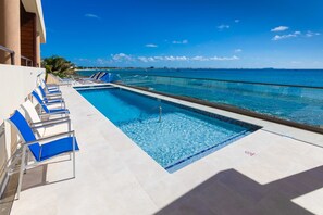 Pool overlooking ocean.