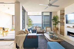 Relax in this cosy living room, overlooking the ocean