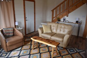Living Room Surrounded by Windows Facing the Sangre de Cristos