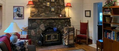 Cozy ninety year old fireplace with an amazing wood stove insert for your use!