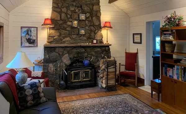 Cozy ninety year old fireplace with an amazing wood stove insert for your use!