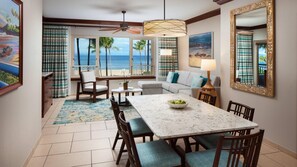 View of dining area and living room out to the Ocean Front view