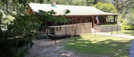 The cabin has a fenced in yard and a handicap ramp. Ample parking space as well.