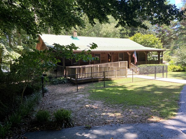 The cabin has a fenced in yard and a handicap ramp. Ample parking space as well.