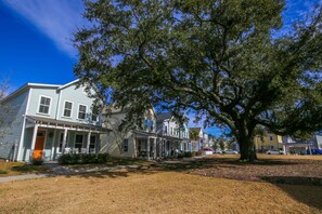 There is a large live oak and dog walking area on the front side of the house.