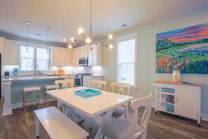 Scout Alley features white cabinetry, stainless steel appliances and granite counters.