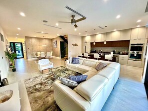 Living room with kitchen in the background