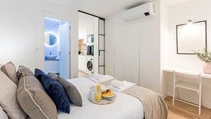 The AC unit in the bedroom ensures you'll have a comfortable stay all year round! #AC