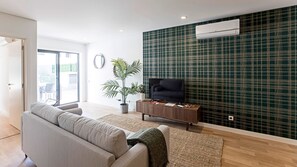 Sofa bed for 2, AC unit and flat screen TV. #comfort