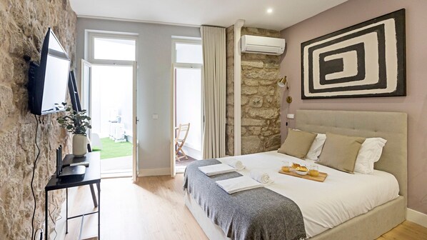 Gorgeous bedroom with exposed stone wall and a comfortable mattress #comfort #lovelystay