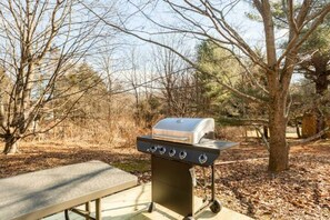 Cottage backyard BBQ and picnic table