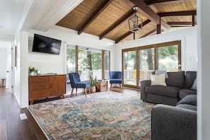 The vaulted living room overlooks the water and gets an incredible amount of natural light.