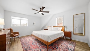 The "master" bedroom has a king size bed and breathtaking sunset views over the lake.