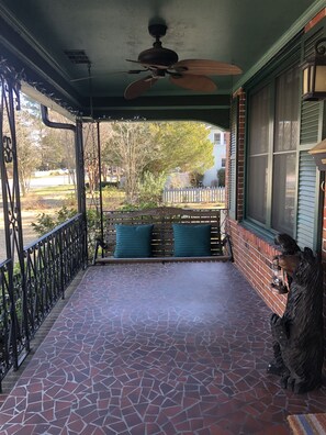 Enjoy the weather and tranquility on the front porch swing. 