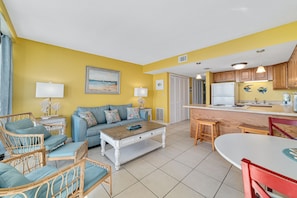Open floor plan living area with sleeper sofa