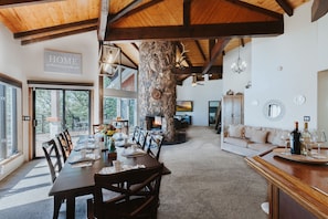 Huge dining table w/ 8 seats that opens up to panoramic back deck.