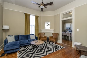 Living area with smart TV and plenty of seating.