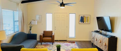 Upstairs living room, balcony access.