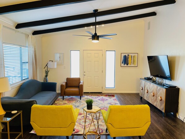 Upstairs living room, balcony access.