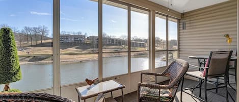 Relax with this beautiful view of the Pointe golf course in the screened in porch!