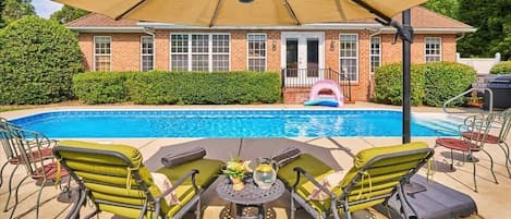 Relax and enjoy the pool with a cold beverage