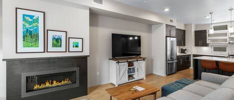 Open concept kitchen, living and dining room on second level.