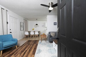A nice view of the living room and a glimpse of the dining area upon entry,