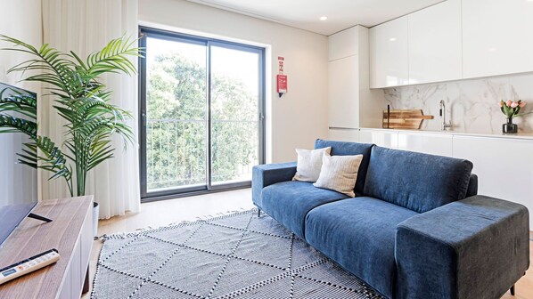 Living area with a sofa and balcony access! #cozy #balcony