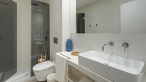 Gorgeous full bathroom with a shower, sink and toilet. Towels included!