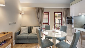 Comfortable sofa, dining area for 4 and bright light coming in! #bright #modern