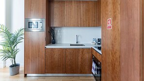 Kitchenette details: sink and cabinets.