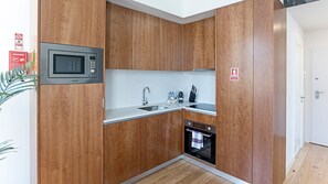 Beautiful design with an elegant wooden kitchen cabinet set. Space that invites you cooking.