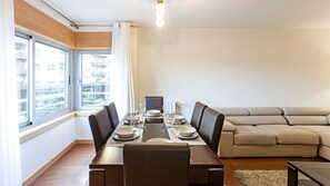 Big dining table located in the living room, next to a big window, to have your meals comfortably with lots of natural light #stunning #spacious