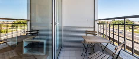 Lovely balcony with some sitting furniture to enjoy a warm summer evening #lovely #practical #airbnbporto