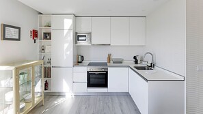 Modern kitchenette, equipped with all the supplies you might need during your stay, like an oven, stove, microwave, kitchen utensils, coffee machine, etc #practical #modern #nice