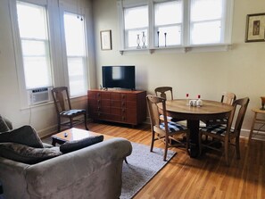 Living room with air conditioning and smart tv with all the popular apps.