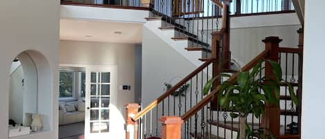 lovely entry way with high ceilings and gorgeous wood floors