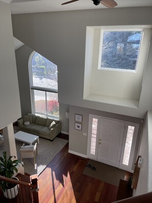 front entry and sitting room from top of stairs