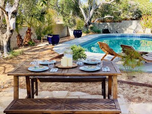 Poolside dining under desert skies
