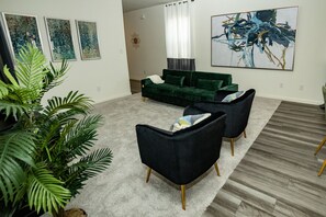 Well furnished living room with several entertainment options