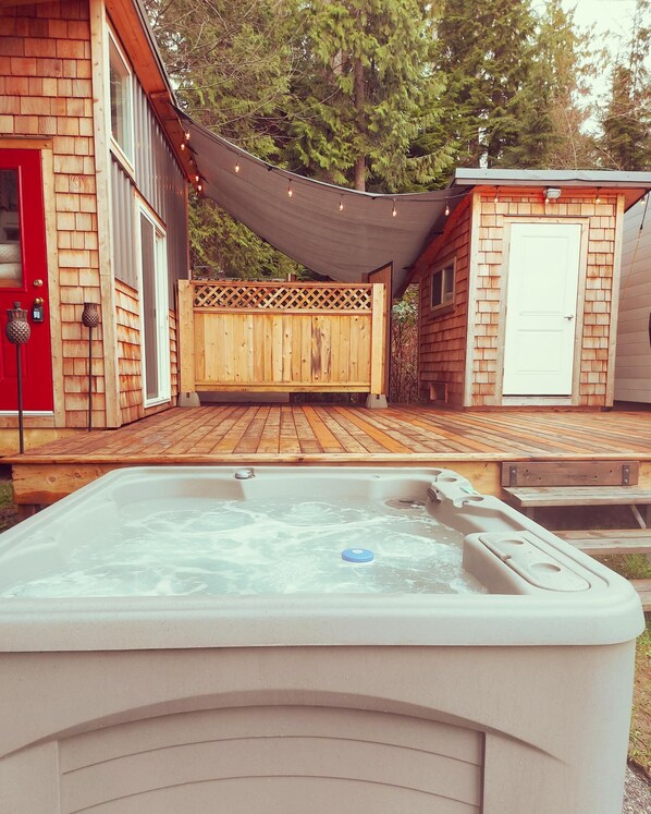 Private hot tub attached to the deck.