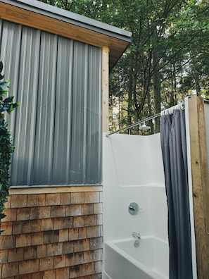 Outdoor shower. The Tiny Cottages does not have an indoor shower.