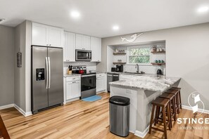 Fully stocked kitchen ready for you to prepare family meals at home.