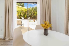 dining area with sliding door to backyard