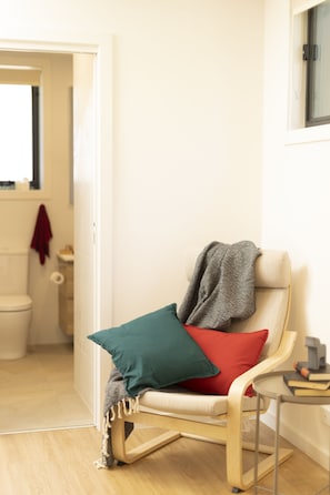 A chair in the bedroom for reading or breastfeeding. 