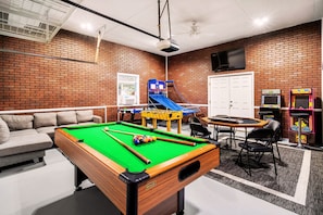 Huge GAME ROOM filled w/ pool table, arcades, air hockey, foosball, pop-a-shot, poker table, board games, large TV and much more!