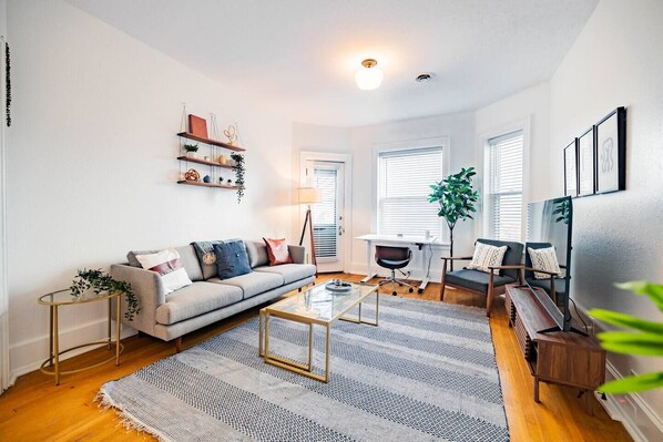 Living room with designated working space.