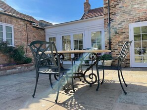 Wrought-iron, marble topped table and chairs